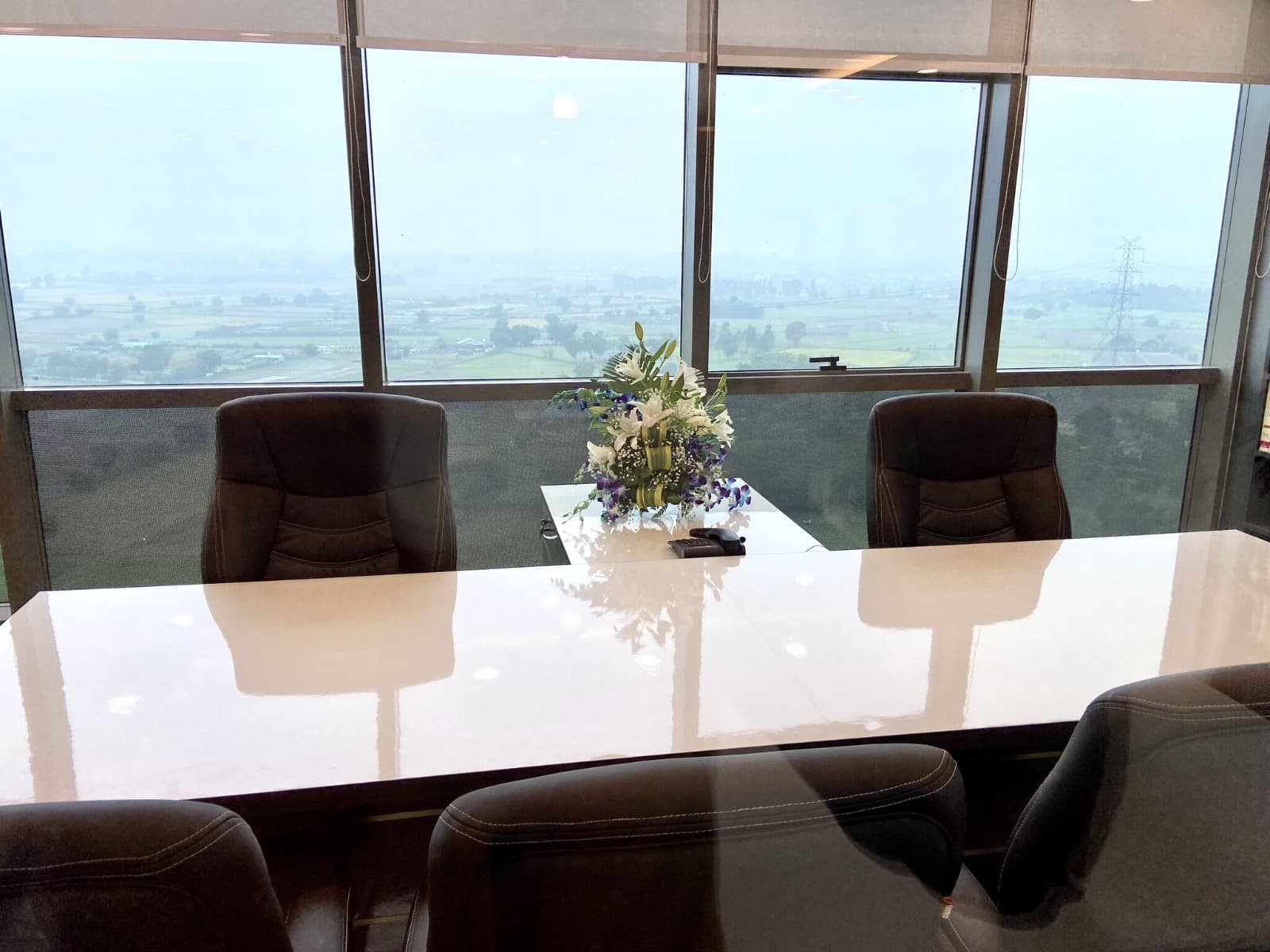 Conference table setup with panoramic views at Dewberry Advisors office
